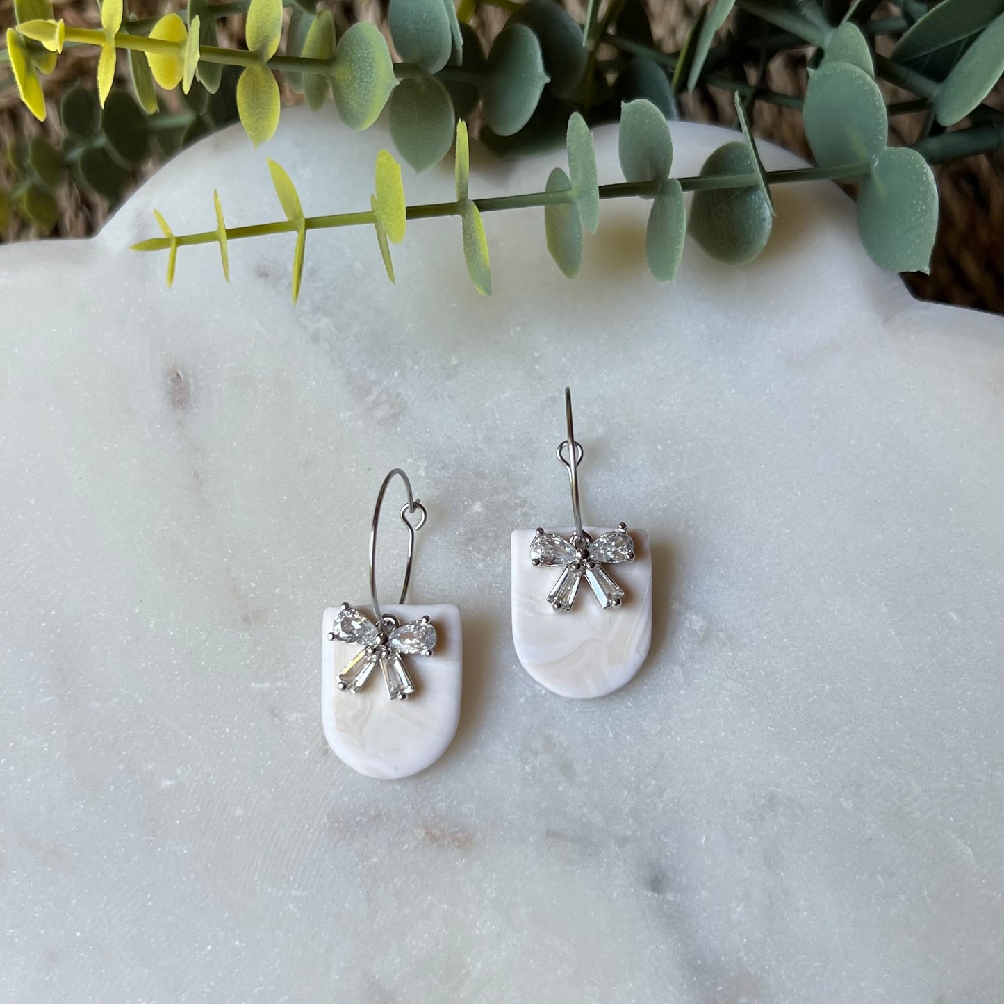 White Marbled Polymer Clay Earrings with CZ Bow