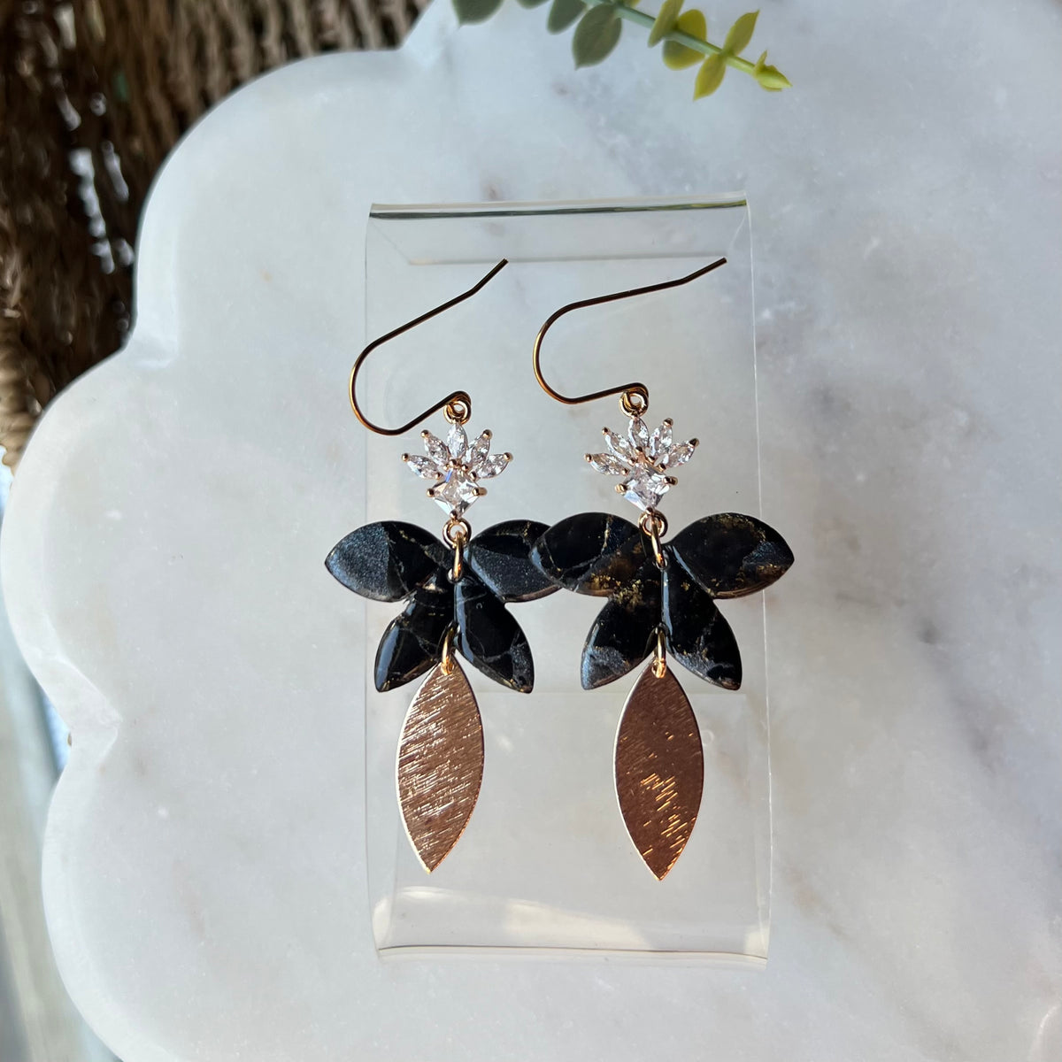 Black floral polymer clay dangle earrings with CZ flower and textured gold leaf