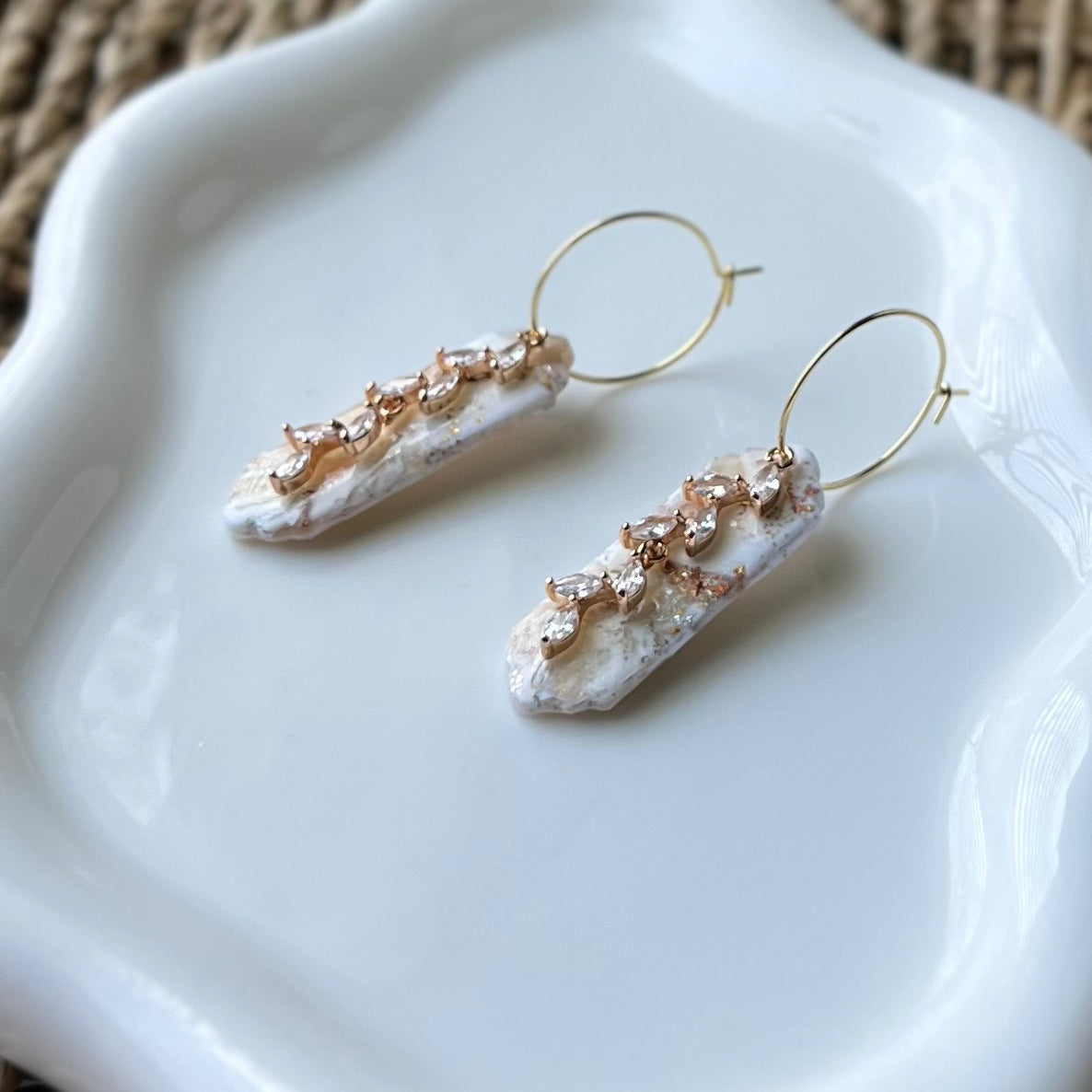 Marbled ivory clay with mixes of gold and silver colors with gold colored stainless steel hoops and cubic zirconia “vine” pendant 